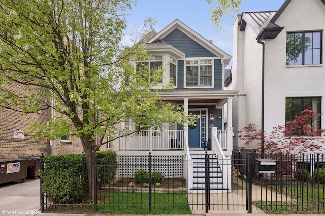 3414 N Bell Ave, Chicago, IL 60618 - view of front of house with a porch, a fenced front yard, and stairs