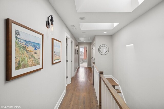 3414 N Bell Ave, Chicago, IL 60618 - hall with an upstairs landing, wood finished floors, a skylight, baseboards, and recessed lighting
