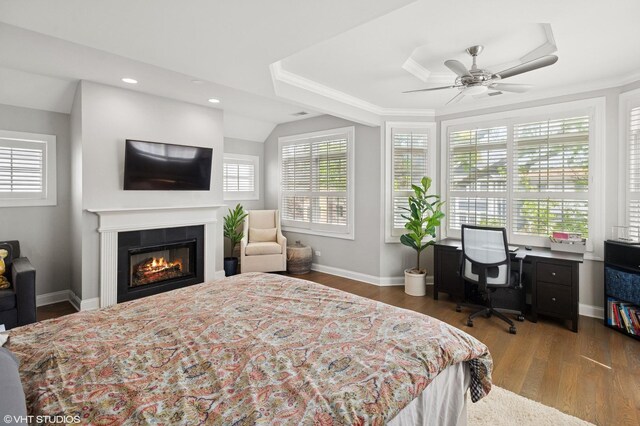 3414 N Bell Ave, Chicago, IL 60618 - bedroom with multiple windows, wood finished floors, a glass covered fireplace, crown molding, and recessed lighting