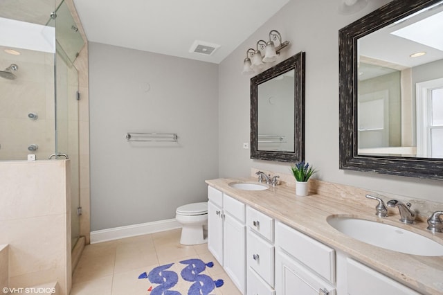 3414 N Bell Ave, Chicago, IL 60618 - bathroom featuring a stall shower, double vanity, toilet, baseboards, and tile patterned floors