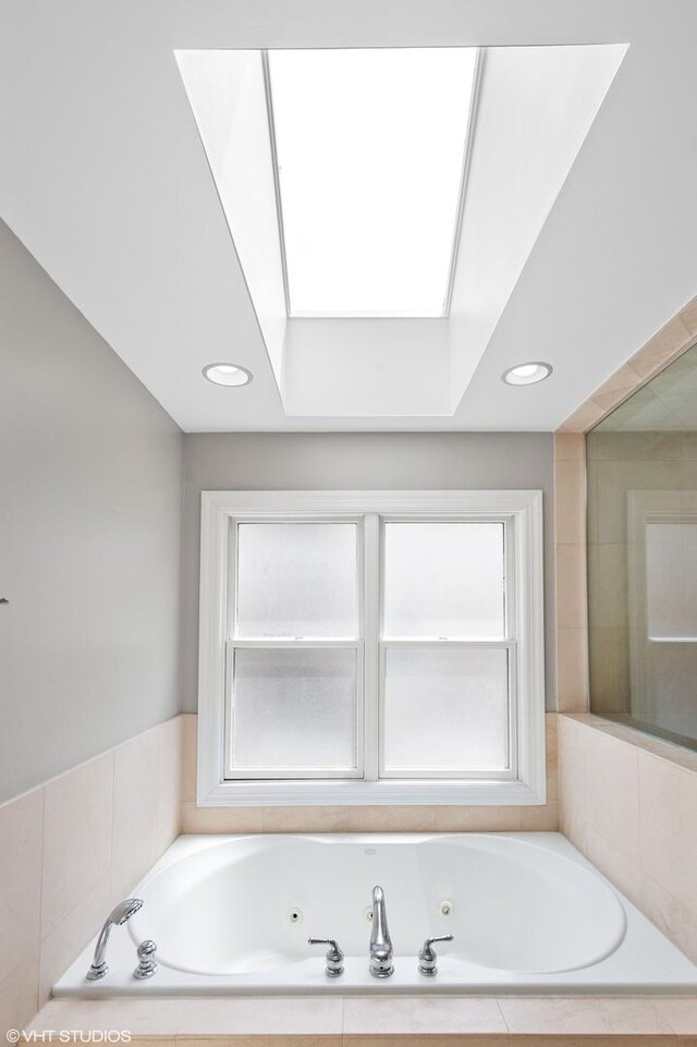 3414 N Bell Ave, Chicago, IL 60618 - bathroom with a whirlpool tub, a skylight, healthy amount of natural light, and recessed lighting