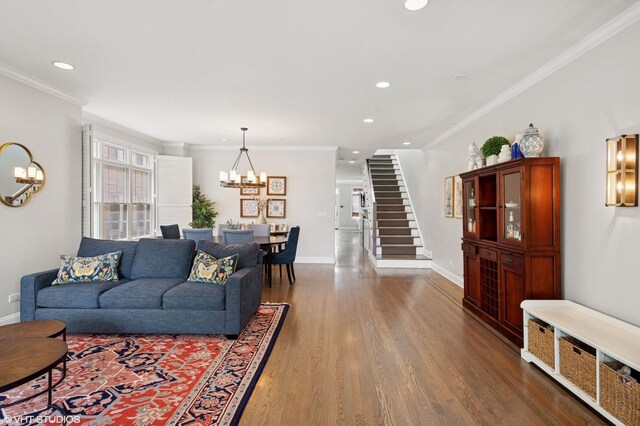 3414 N Bell Ave, Chicago, IL 60618 - living room with a chandelier, dark wood-style floors, recessed lighting, crown molding, and baseboards