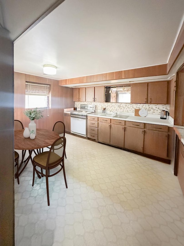 5431 S 7th Ave, Countryside, IL 60525 - kitchen with electric stove, a sink, light countertops, and light flooring