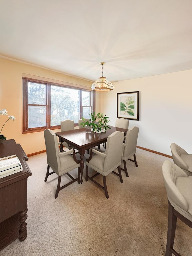 5431 S 7th Ave, Countryside, IL 60525 - dining room featuring baseboards, light carpet, and a chandelier