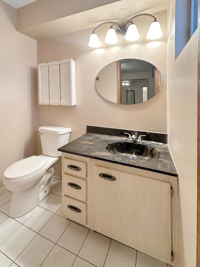 5431 S 7th Ave, Countryside, IL 60525 - half bath featuring vanity, toilet, and tile patterned floors