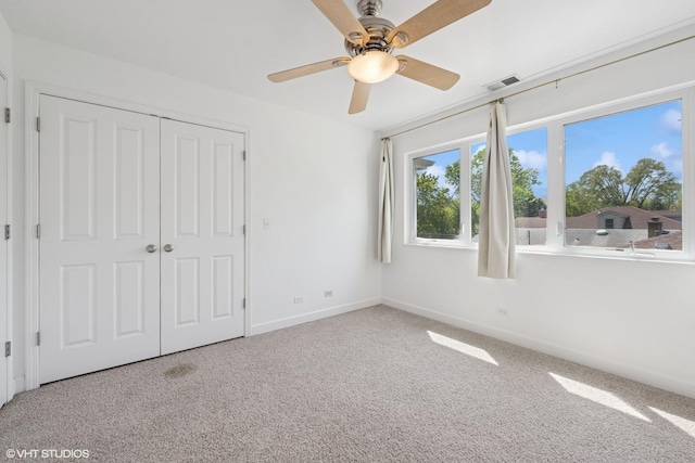 877 Hollywood Ave, Des Plaines, IL 60016 - unfurnished bedroom with carpet flooring, a closet, baseboards, and ceiling fan
