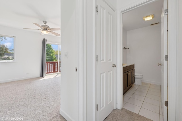 877 Hollywood Ave, Des Plaines, IL 60016 - hallway featuring light colored carpet, baseboards, and light tile patterned flooring