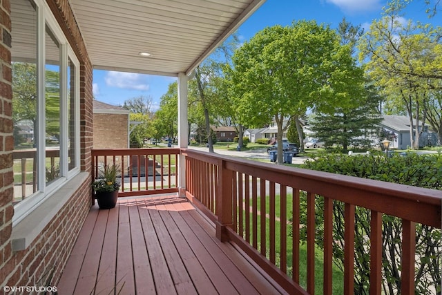 877 Hollywood Ave, Des Plaines, IL 60016 - wooden porch with a residential view