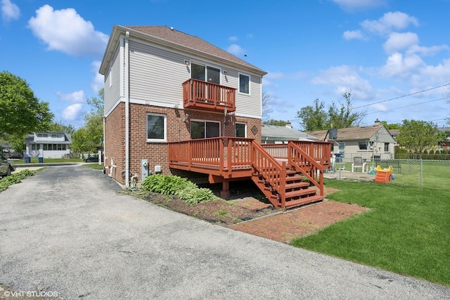 877 Hollywood Ave, Des Plaines, IL 60016 - rear view of property with brick siding, a deck, a balcony, and asphalt driveway