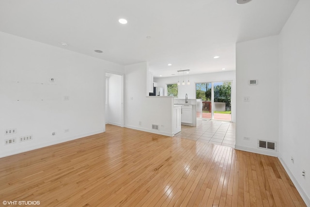 877 Hollywood Ave, Des Plaines, IL 60016 - unfurnished room featuring light wood-style floors, baseboards, and recessed lighting