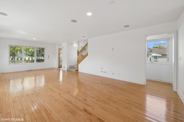 877 Hollywood Ave, Des Plaines, IL 60016 - unfurnished living room with healthy amount of natural light, stairway, light wood-style floors, and recessed lighting