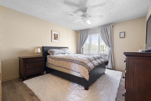 16203 Fox Ct, Orland Hills, IL 60487 - bedroom with a textured ceiling, wood finished floors, baseboards, and ceiling fan