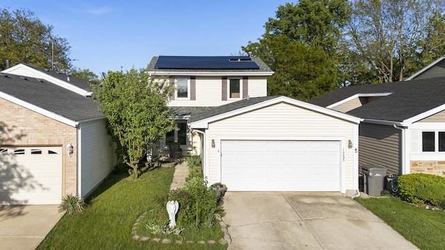 16203 Fox Ct, Orland Hills, IL 60487 - traditional-style home featuring concrete driveway, an attached garage, solar panels, and a front yard