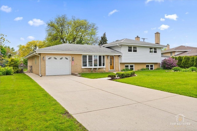 9258 Clancy Dr, Des Plaines, IL 60016 - split level home with an attached garage, concrete driveway, a front yard, a chimney, and brick siding