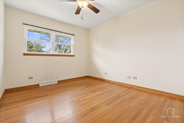 9258 Clancy Dr, Des Plaines, IL 60016 - empty room with light wood-style floors, ceiling fan, and baseboards