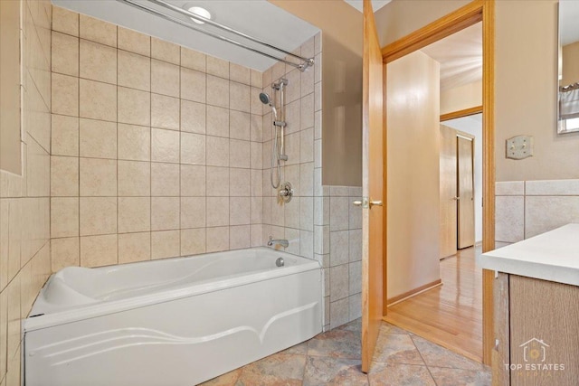 9258 Clancy Dr, Des Plaines, IL 60016 - full bath featuring tile walls, shower / bath combination, vanity, and a wainscoted wall