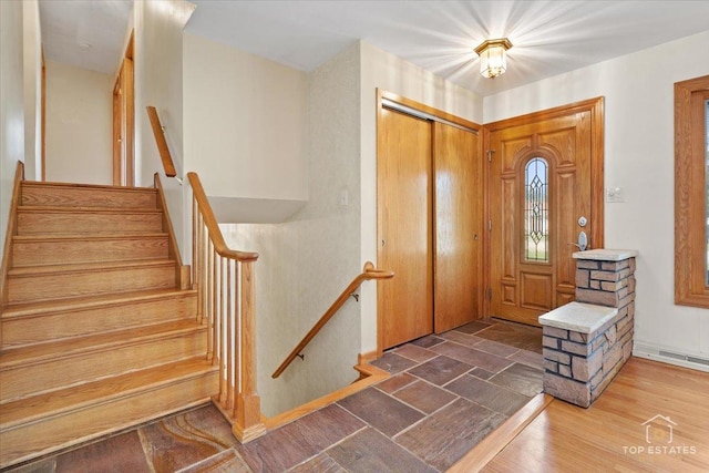9258 Clancy Dr, Des Plaines, IL 60016 - foyer with stairway and wood finished floors