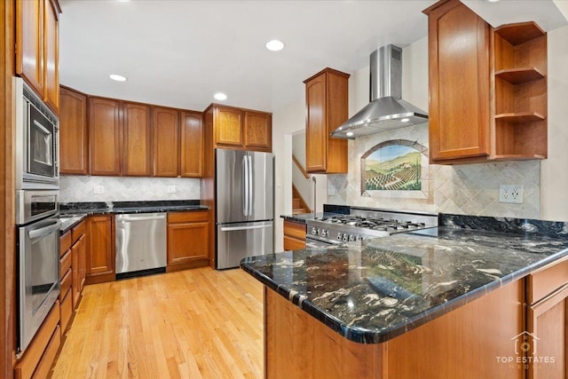 9258 Clancy Dr, Des Plaines, IL 60016 - kitchen with appliances with stainless steel finishes, wall chimney exhaust hood, light wood-style floors, brown cabinets, and a peninsula
