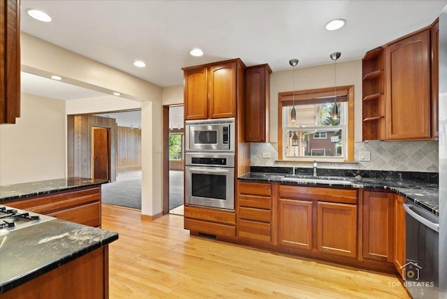 9258 Clancy Dr, Des Plaines, IL 60016 - kitchen with stainless steel appliances, a sink, plenty of natural light, decorative backsplash, and recessed lighting