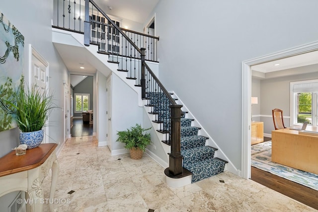 3118 Oliver Ln, Northbrook, IL 60062 - stairs featuring baseboards and a towering ceiling