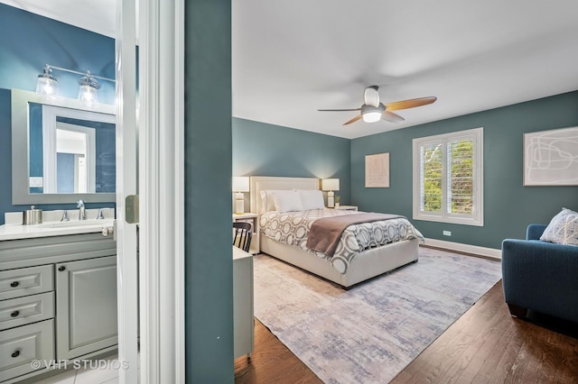 3118 Oliver Ln, Northbrook, IL 60062 - bedroom featuring a sink, dark wood-style flooring, baseboards, and a ceiling fan
