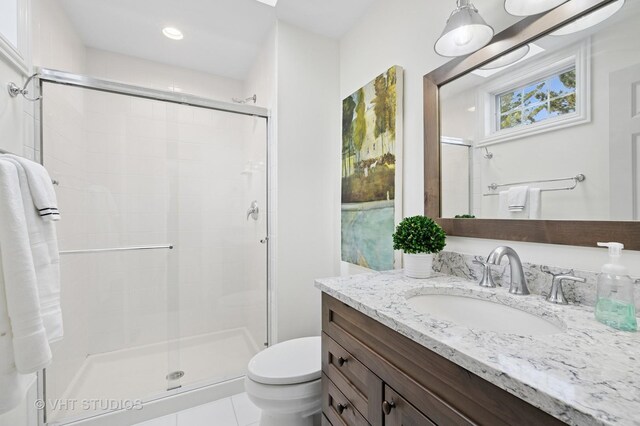 3118 Oliver Ln, Northbrook, IL 60062 - bathroom featuring a stall shower, vanity, toilet, tile patterned floors, and recessed lighting