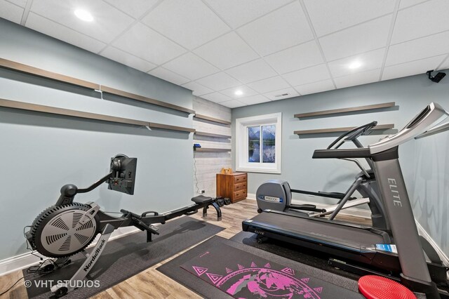 3118 Oliver Ln, Northbrook, IL 60062 - workout room with wood finished floors, baseboards, a paneled ceiling, and recessed lighting
