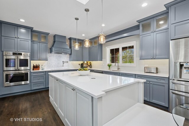 3118 Oliver Ln, Northbrook, IL 60062 - kitchen featuring premium range hood, stainless steel appliances, light countertops, decorative backsplash, and recessed lighting