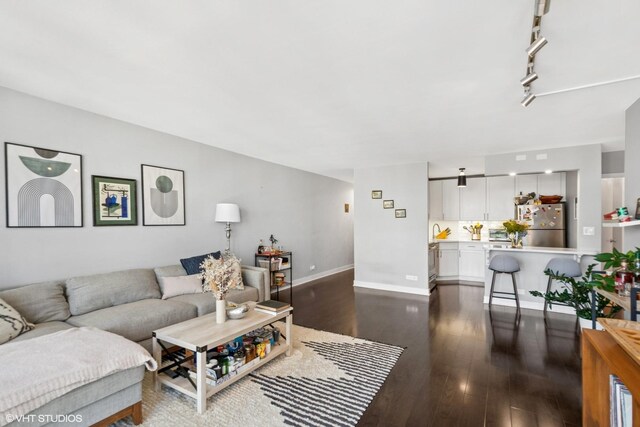 1636 N Wells St Unit 1107, Chicago, IL 60614 - living room featuring dark wood-type flooring and baseboards