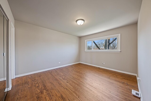 502 Antietam St, Park Forest, IL 60466 - empty room with baseboards and wood finished floors
