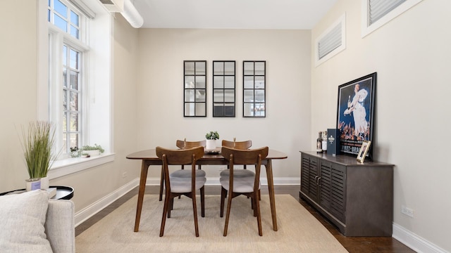 636 N Racine Ave Unit 2N, Chicago, IL 60642 - dining area featuring baseboards and dark wood-type flooring