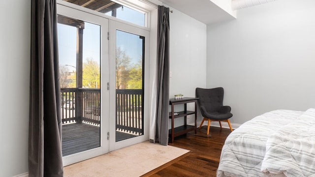 636 N Racine Ave Unit 2N, Chicago, IL 60642 - bedroom featuring access to exterior, wood finished floors, and baseboards
