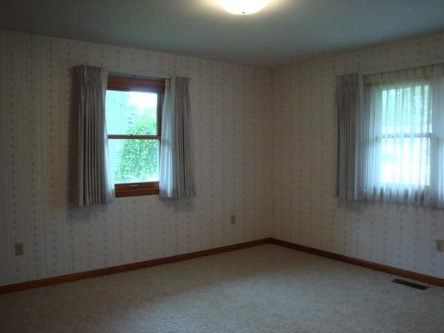 423 W Garfield Ave, Cissna Park, IL 60924 - empty room featuring carpet flooring