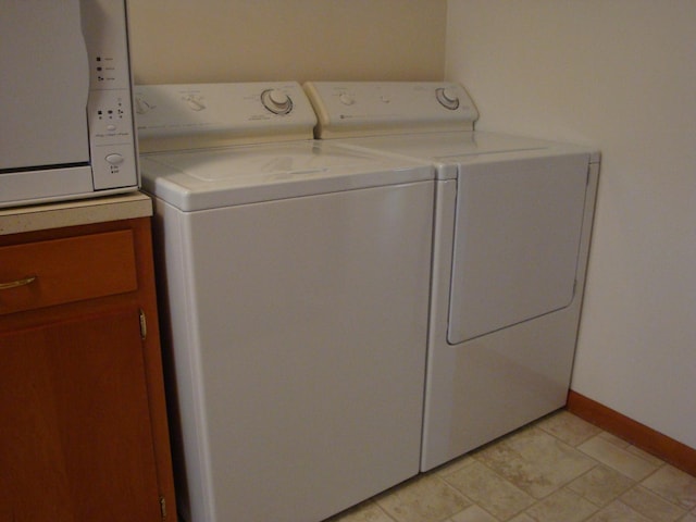 423 W Garfield Ave, Cissna Park, IL 60924 - laundry room with washing machine and clothes dryer and baseboards