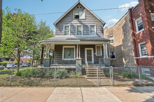 3754 W Sunnyside Ave, Chicago, IL 60625 - traditional style home featuring a porch, a fenced front yard, and a gate