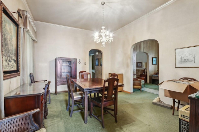 3754 W Sunnyside Ave, Chicago, IL 60625 - carpeted dining space featuring arched walkways, ornamental molding, a chandelier, and baseboards