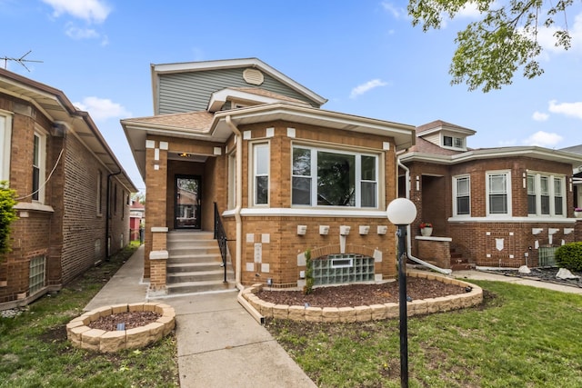 8114 S Paxton Ave, Chicago, IL 60617 - view of front of property with brick siding and a fire pit