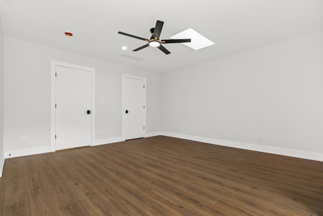 8114 S Paxton Ave, Chicago, IL 60617 - unfurnished bedroom with dark wood finished floors, a skylight, baseboards, and recessed lighting