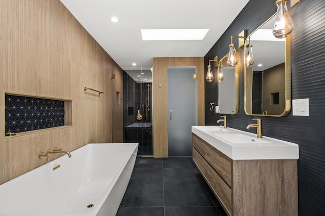 8114 S Paxton Ave, Chicago, IL 60617 - bathroom with a skylight, a soaking tub, tile patterned flooring, double vanity, and a shower