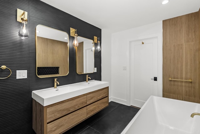 8114 S Paxton Ave, Chicago, IL 60617 - bathroom with a freestanding tub, double vanity, recessed lighting, and baseboards