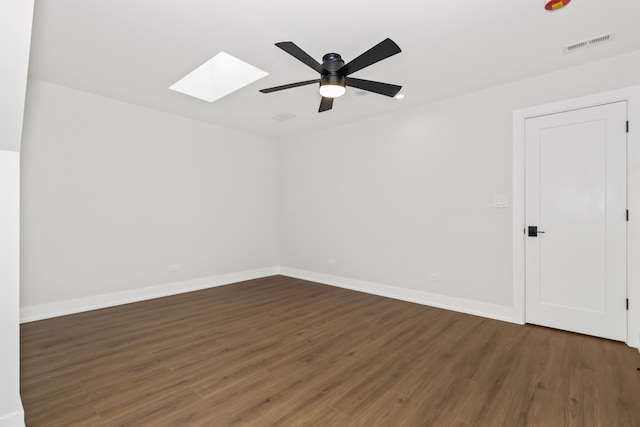 8114 S Paxton Ave, Chicago, IL 60617 - unfurnished room with a skylight, wood finished floors, ceiling fan, and baseboards