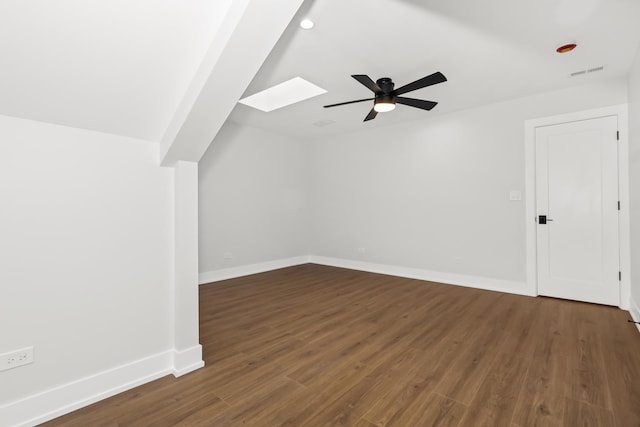 8114 S Paxton Ave, Chicago, IL 60617 - additional living space featuring a skylight, a ceiling fan, dark wood-type flooring, baseboards, and lofted ceiling