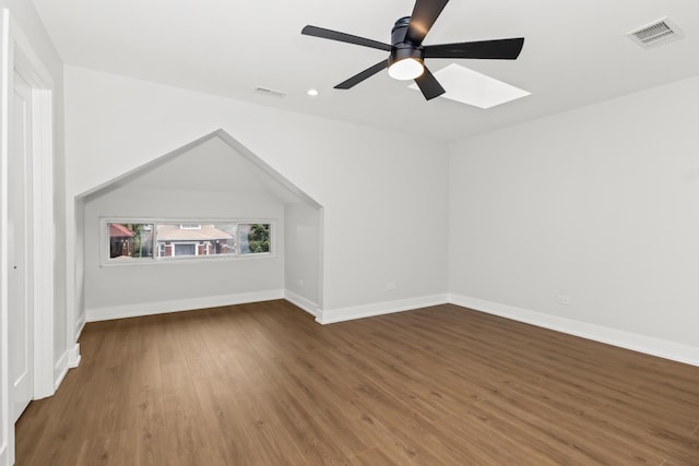 8114 S Paxton Ave, Chicago, IL 60617 - additional living space featuring a ceiling fan, a skylight, wood finished floors, baseboards, and recessed lighting