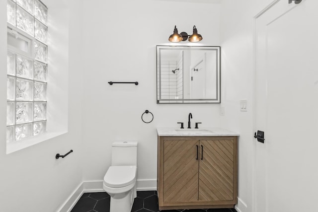 8114 S Paxton Ave, Chicago, IL 60617 - full bathroom featuring vanity, toilet, baseboards, tile patterned flooring, and a shower