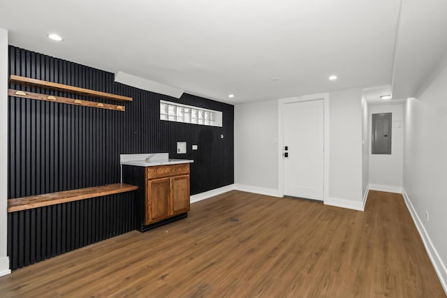 8114 S Paxton Ave, Chicago, IL 60617 - bar featuring baseboards, electric panel, dark wood finished floors, and recessed lighting