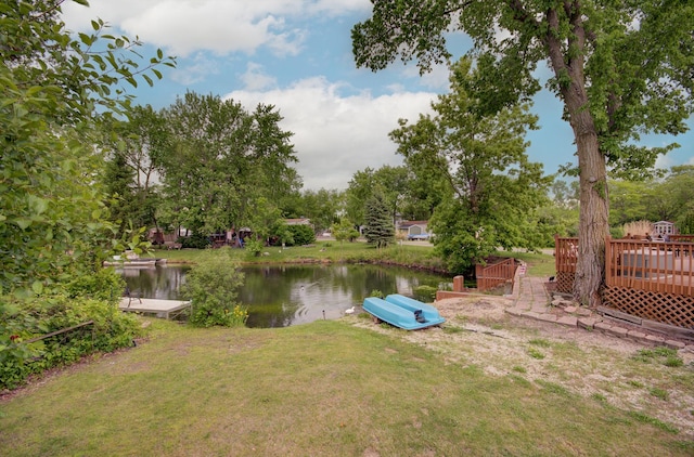 195 Fossil Cove Ln, Wilmington, IL 60481 - view of grassy yard featuring a deck with water view and view of wooded area