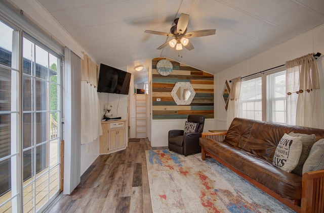 195 Fossil Cove Ln, Wilmington, IL 60481 - living room with wood finished floors, ceiling fan, vaulted ceiling, and wooden walls