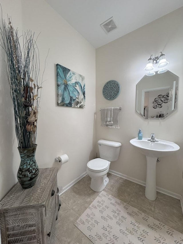 756 Lambert Ln, Bartlett, IL 60103 - half bathroom featuring toilet, tile patterned floors, and baseboards
