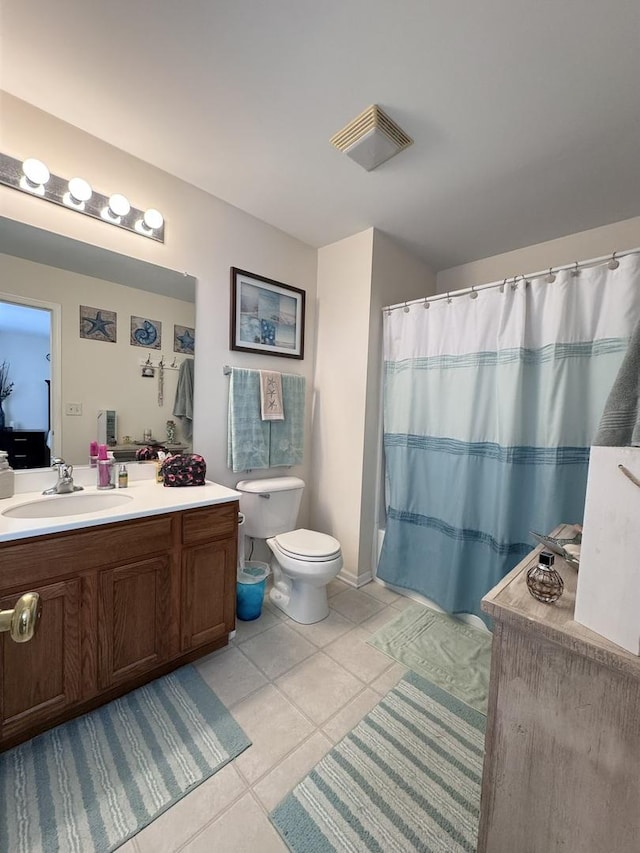756 Lambert Ln, Bartlett, IL 60103 - bathroom with tile patterned flooring, toilet, vanity, and a shower with shower curtain