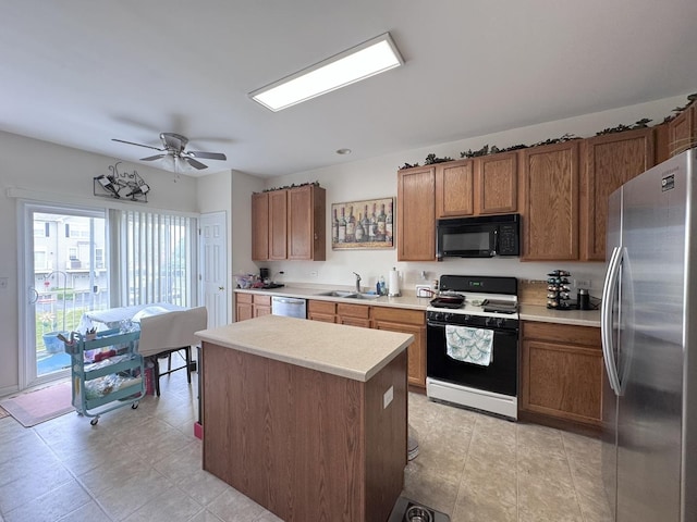756 Lambert Ln, Bartlett, IL 60103 - kitchen featuring appliances with stainless steel finishes, a sink, brown cabinetry, light countertops, and a ceiling fan